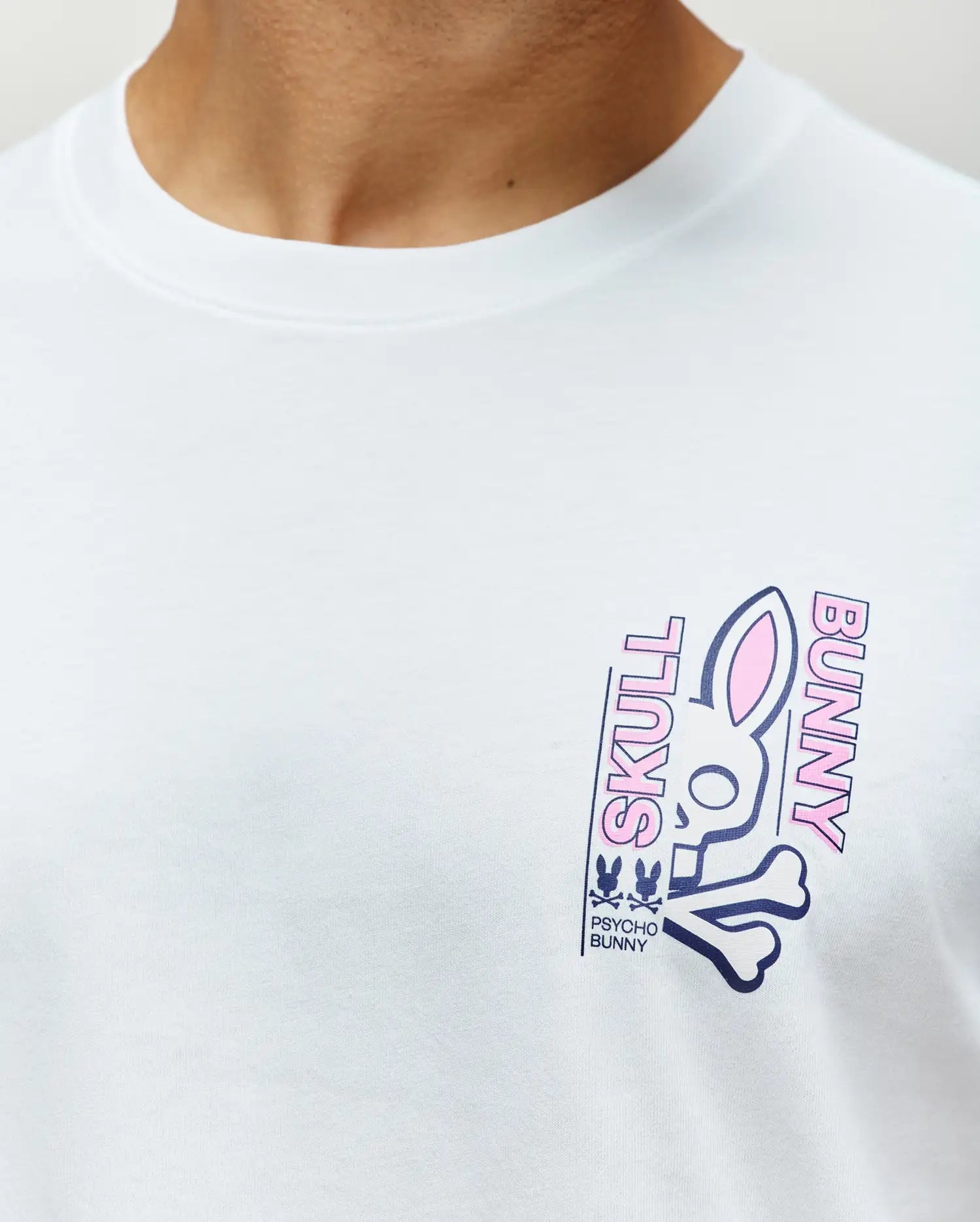 White Mens Skull Bunny Graphic Tee, classic fit, smooth jersey fabric, featuring a large navy and pink bunny skull graphic print on the left chest with SKULL BUNNY text.