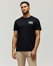 Mens Jarvis Chest Graphic Tee, a classic fit black jersey knit t-shirt with a subtle, tonal grey rectangular Psycho Bunny logo graphic on the left chest.