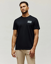Mens Jarvis Chest Graphic Tee, a classic fit black jersey knit t-shirt with a subtle, tonal grey rectangular Psycho Bunny logo graphic on the left chest.
