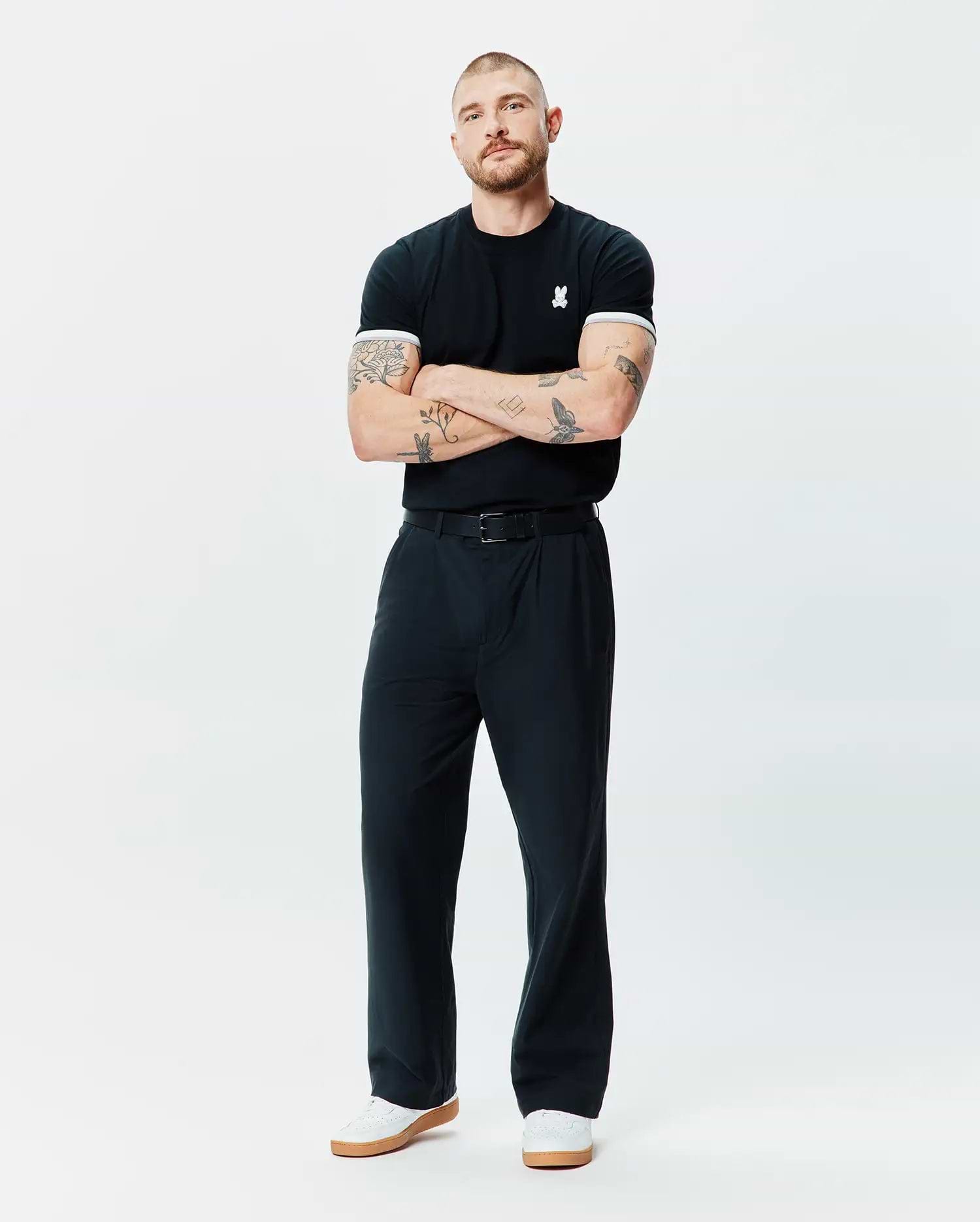 Black Mens Holden Tee in classic fit jersey knit, featuring a small white embroidered Psycho Bunny skull logo on the left chest and white ribbed cuffs.