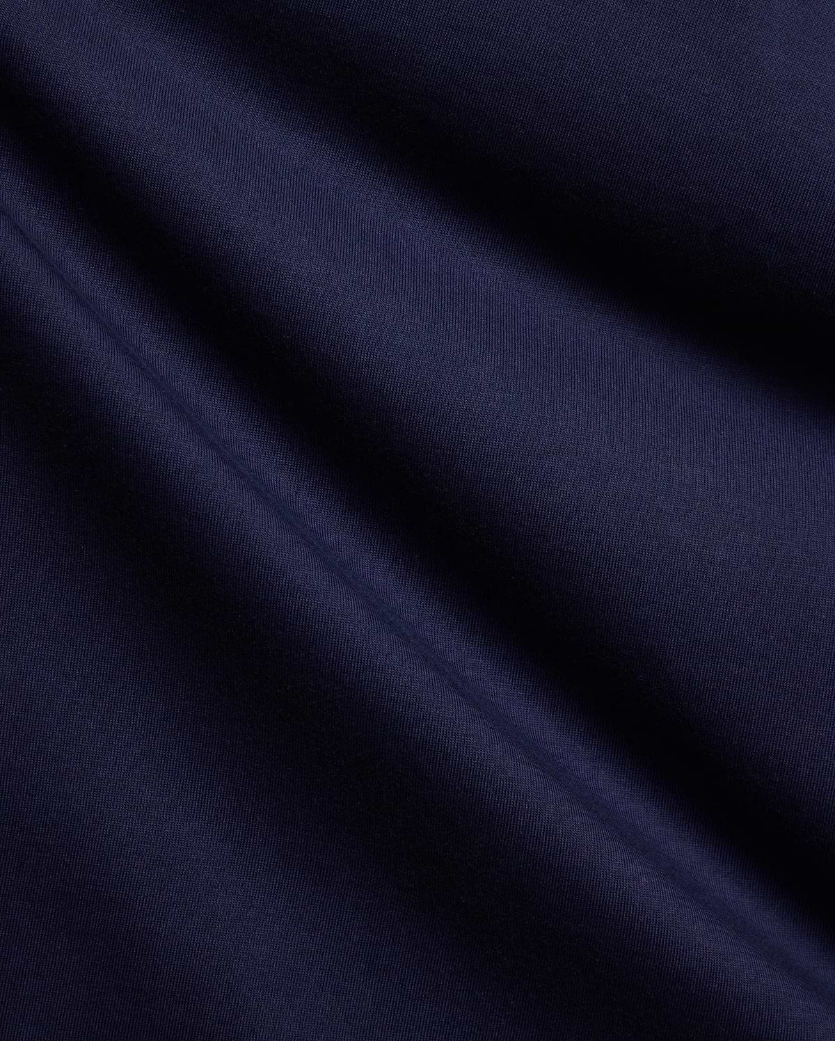 Mens Holden Tee, a premium deep navy blue jersey knit fabric, showcasing its smooth, soft texture and subtle, elegant folds, perfect for refined streetwear style. (6)