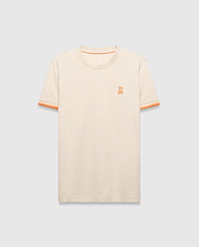 Cream Mens Holden Tee, a classic fit jersey knit t-shirt featuring a small embroidered orange Psycho Bunny skull logo on the left chest and orange striped ribbed sleeve cuffs.