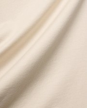 Mens Holden Tee, a premium quality t-shirt in a soft, light beige cotton jersey knit, featuring a smooth texture and elegant drape, characteristic of refined streetwear.