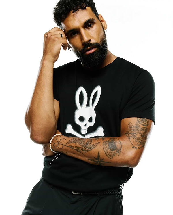 Mens Emmanuel Pima Cotton Graphic Tee, a classic fit black smooth jersey t-shirt featuring a large white Psycho Bunny skull and crossbones graphic centered on the chest.