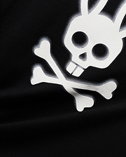 Mens Emmanuel Pima Cotton Graphic Tee in black, showcasing a prominent, distressed white Psycho Bunny skull and crossbones graphic print on its soft jersey fabric.