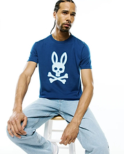 Mens Emmanuel Graphic Tee in deep blue, featuring a classic fit and smooth jersey fabric. A large, centered white Psycho Bunny skull and crossbones graphic is prominently displayed on the chest.