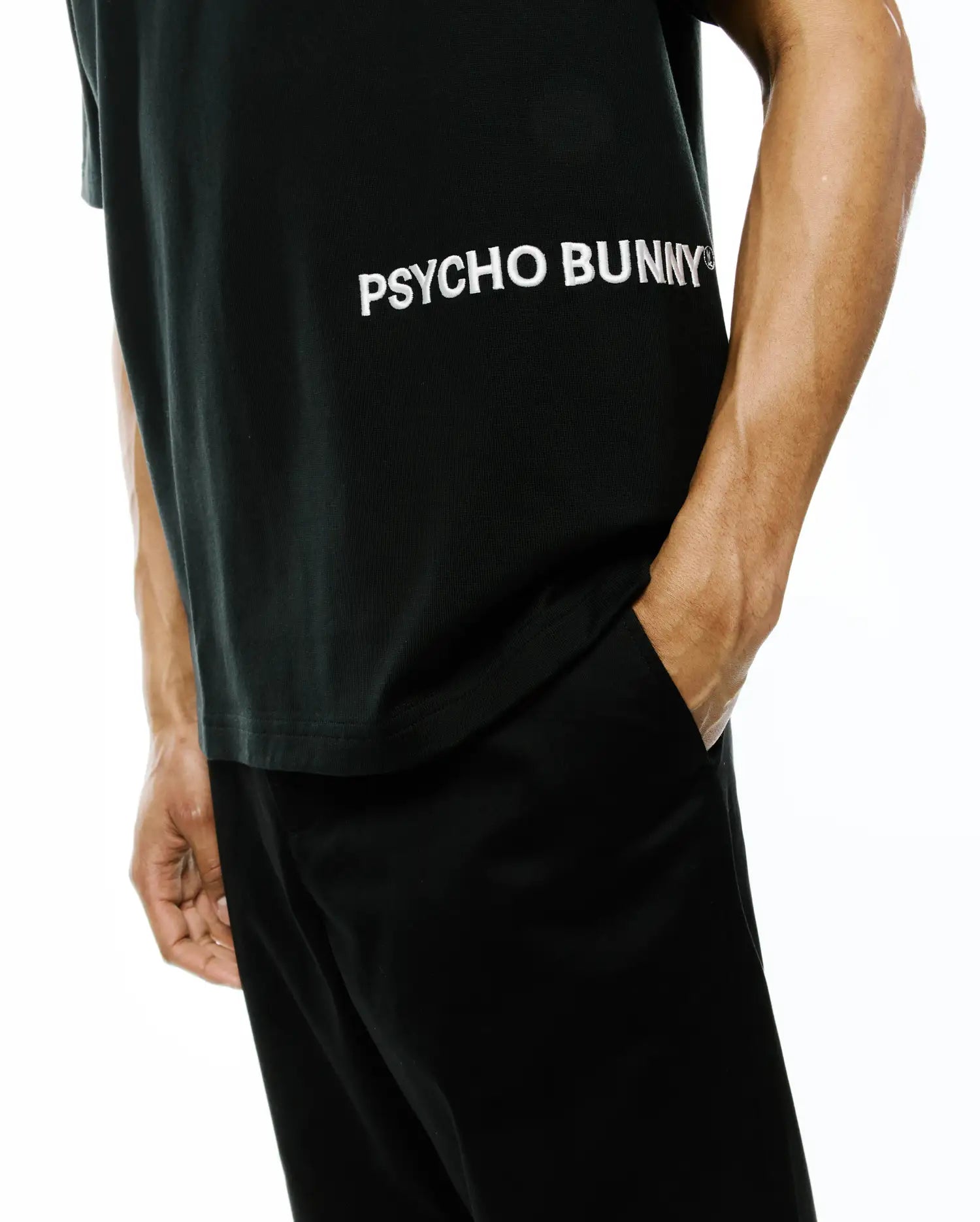 Mens Haiden Relaxed Heavy Weight Tee in black, featuring a large white horizontal PSYCHO BUNNY text logo across the chest, crafted from a smooth, heavyweight jersey fabric.