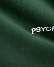 Mens Haiden Relaxed Heavy Weight Tee in dark green, featuring a heavyweight jersey knit texture and a prominent embroidered white Psycho Bunny PSYCH text logo. (6)