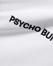 White Mens Haiden Relaxed Heavy Weight Tee, a heavy jersey knit, featuring prominent black embroidered PSYCHO BUNNY text diagonally across the front.