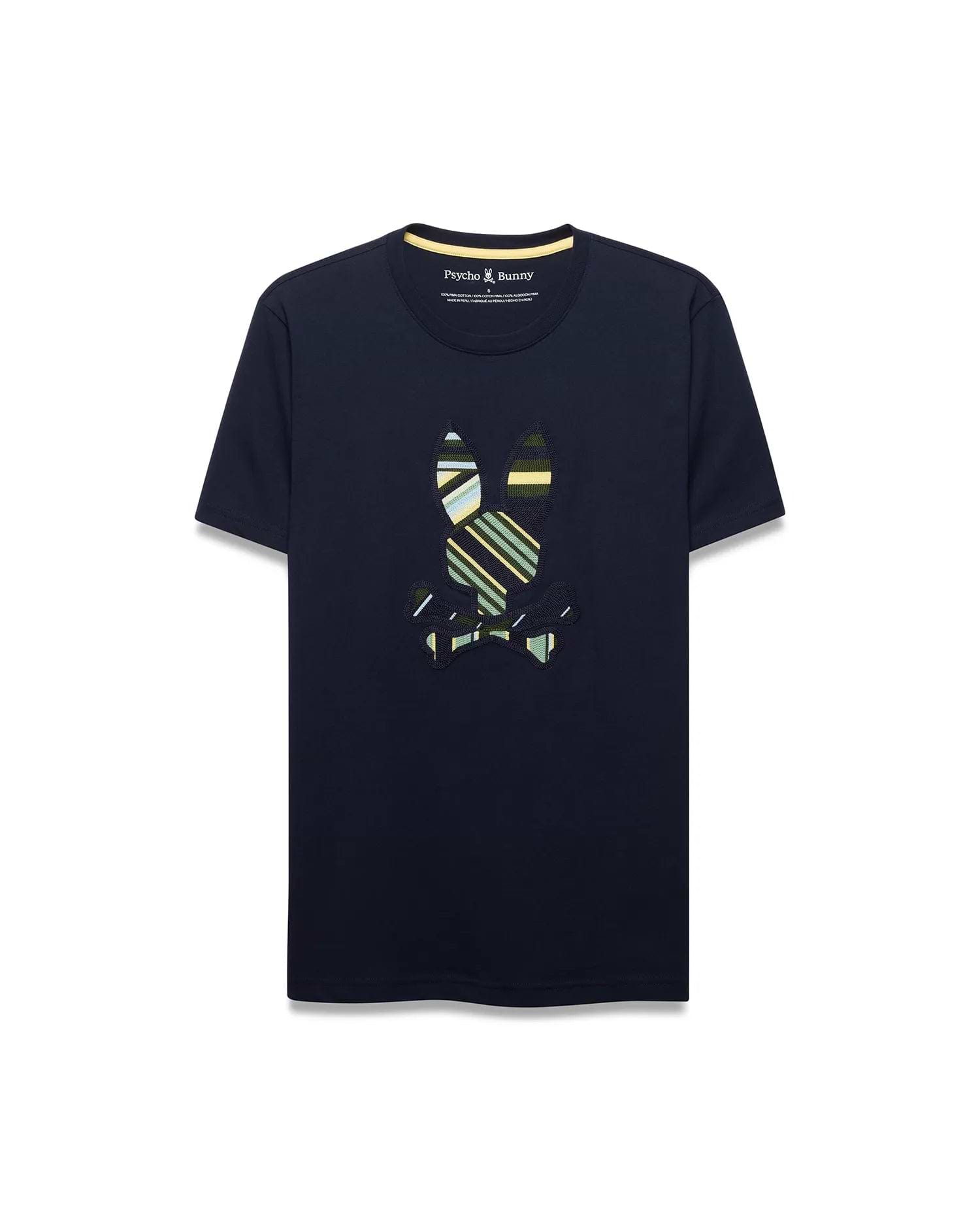 Mens Drew Embroidered Graphic Tee, a navy classic fit jersey t-shirt with a large, center chest embroidered Psycho Bunny skull logo featuring bold green, yellow, and white stripes, and a yellow inner collar trim.