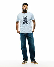 Mens Jaden Appliqué Graphic Tee, a light blue classic fit jersey t-shirt featuring a large central navy and white patterned Psycho Bunny skull and crossbones logo.