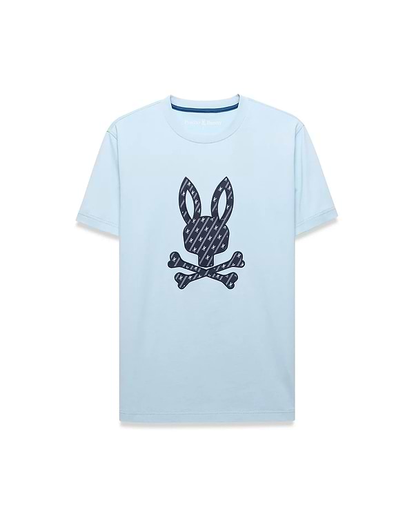 Mens Jaden Graphic Tee, a light blue classic fit jersey t-shirt featuring a large central dark blue Psycho Bunny skull logo graphic filled with a repeating mini-logo pattern, with subtle inner collar branding.