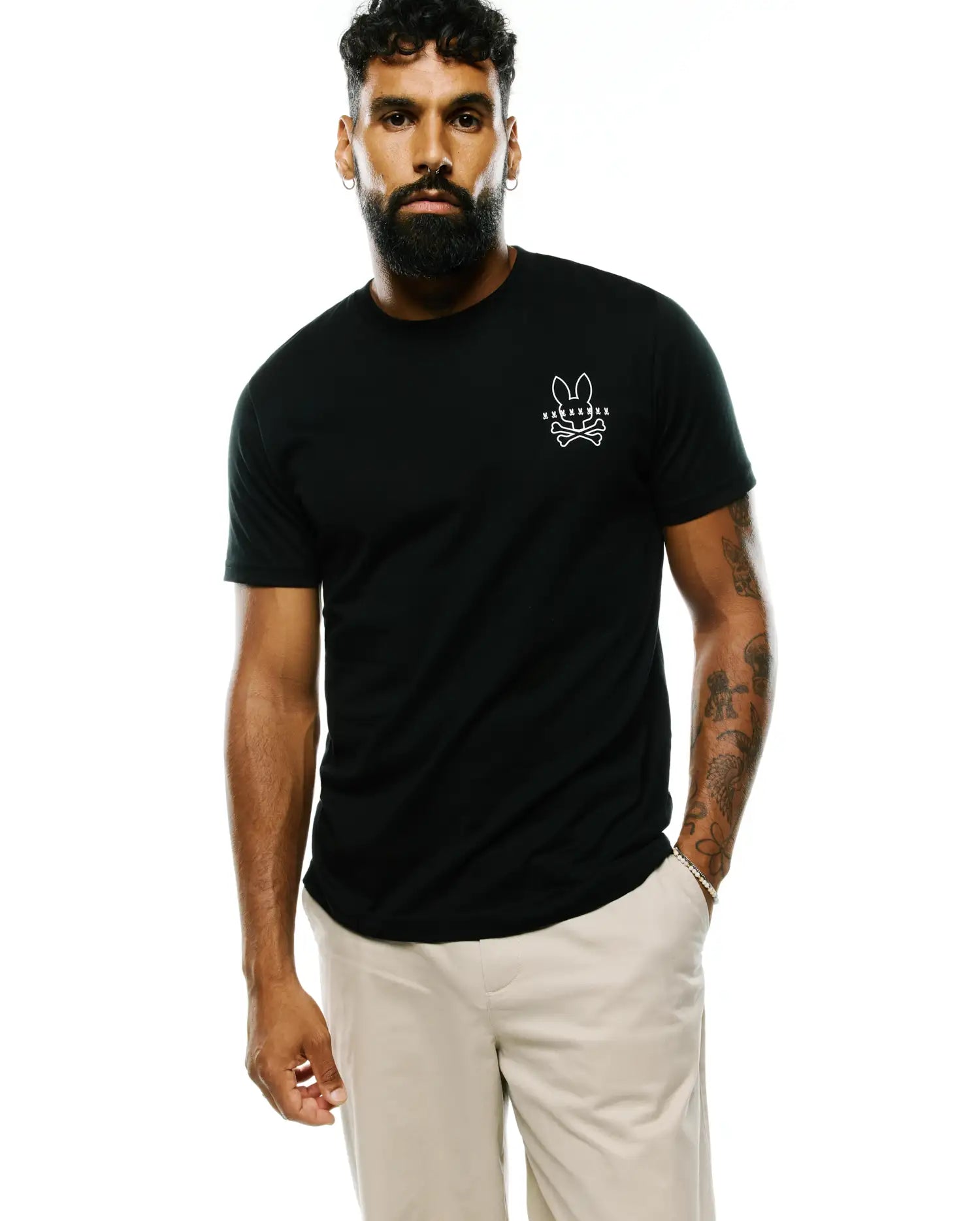 Black classic fit Mens Piers Pima Cotton Back Graphic Tee, crafted from smooth Pima cotton jersey, featuring a small white Psycho Bunny skull and crossbones logo on the left chest.