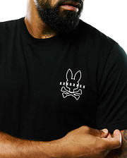Mens Piers Pima Cotton Back Graphic Tee. Black classic fit Pima cotton jersey t-shirt with a large white outline Psycho Bunny skull and crossbones chest graphic, detailed with smaller bunny skulls.