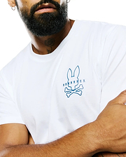 Mens Piers Pima Cotton Back Graphic Tee, a classic fit white Pima cotton jersey t-shirt featuring a prominent blue Psycho Bunny skull logo on the left chest, accented by smaller blue bunny skulls above.
