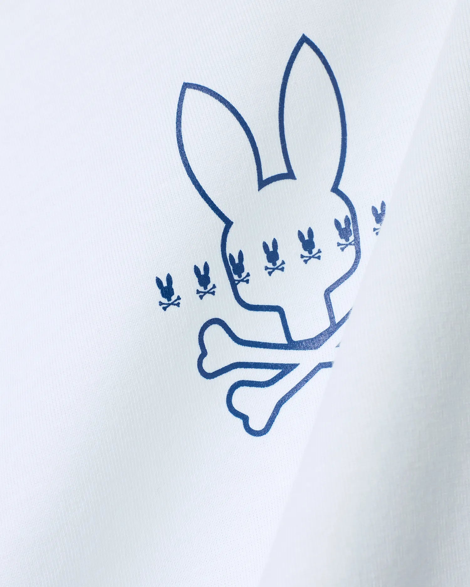 White Mens Piers Pima Cotton Back Graphic Tee with a large blue outline Psycho Bunny skull logo, detailed with smaller repeating blue bunny skull graphics on soft Pima cotton jersey.