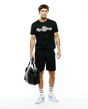 Black MENS JAYDON WORDMARK GRAPHIC TEE in a classic fit, crafted from soft jersey fabric, featuring a large white Psycho Bunny wordmark logo with red ears and blue eyes centered on the chest.