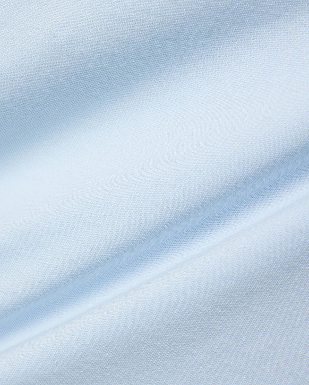 Mens Jaydon Wordmark Graphic Tee, a premium light blue jersey knit fabric with a smooth, soft texture and subtle, flowing folds, reflecting refined streetwear quality.