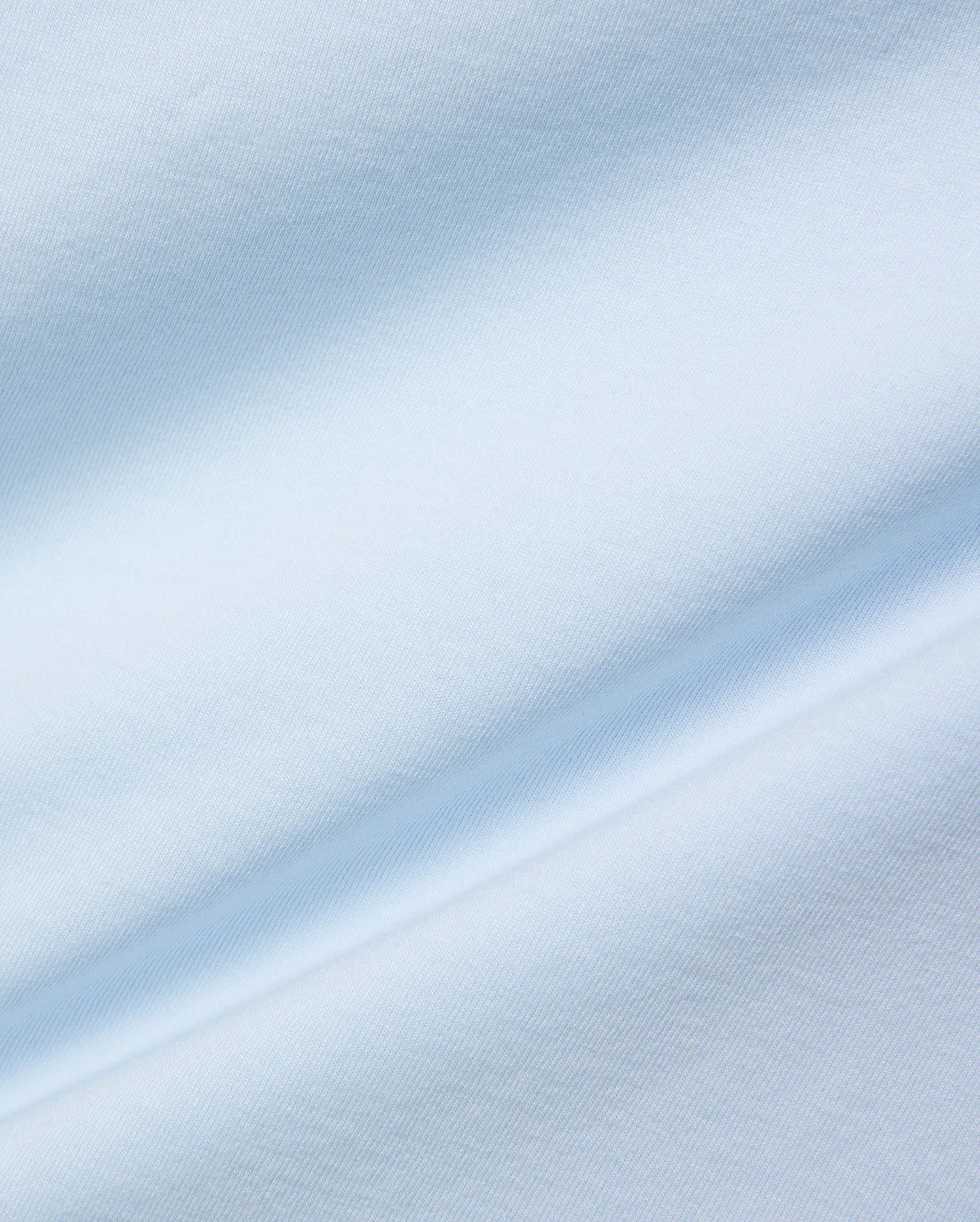 Mens Jaydon Wordmark Graphic Tee, a premium light blue jersey knit fabric with a smooth, soft texture and subtle, flowing folds, reflecting refined streetwear quality.