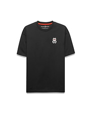Black Mens Jaydon Relaxed Fit Tee with a red inner neckline, featuring a small embroidered white, red, and black Psycho Bunny skull logo on the left chest. Soft jersey knit, relaxed fit.