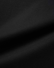 Mens Jaydon Relaxed Fit Tee in deep black, crafted from a premium, soft-touch jersey knit fabric with a subtle, refined texture, embodying Psycho Bunny's signature comfortable streetwear aesthetic.