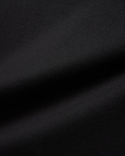 Mens Jaydon Relaxed Fit Tee in deep black, crafted from a premium, soft-touch jersey knit fabric with a subtle, refined texture, embodying Psycho Bunny's signature comfortable streetwear aesthetic.