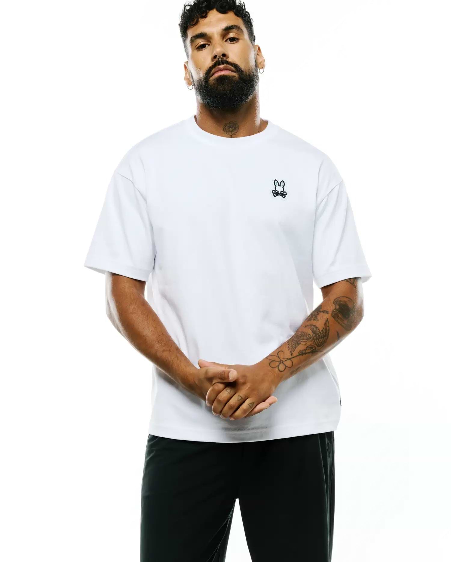 Mens Jaydon Pima Cotton Oversized-Fit Tee, a white smooth Pima cotton jersey t-shirt featuring a small black embroidered Psycho Bunny skull logo on the left chest.