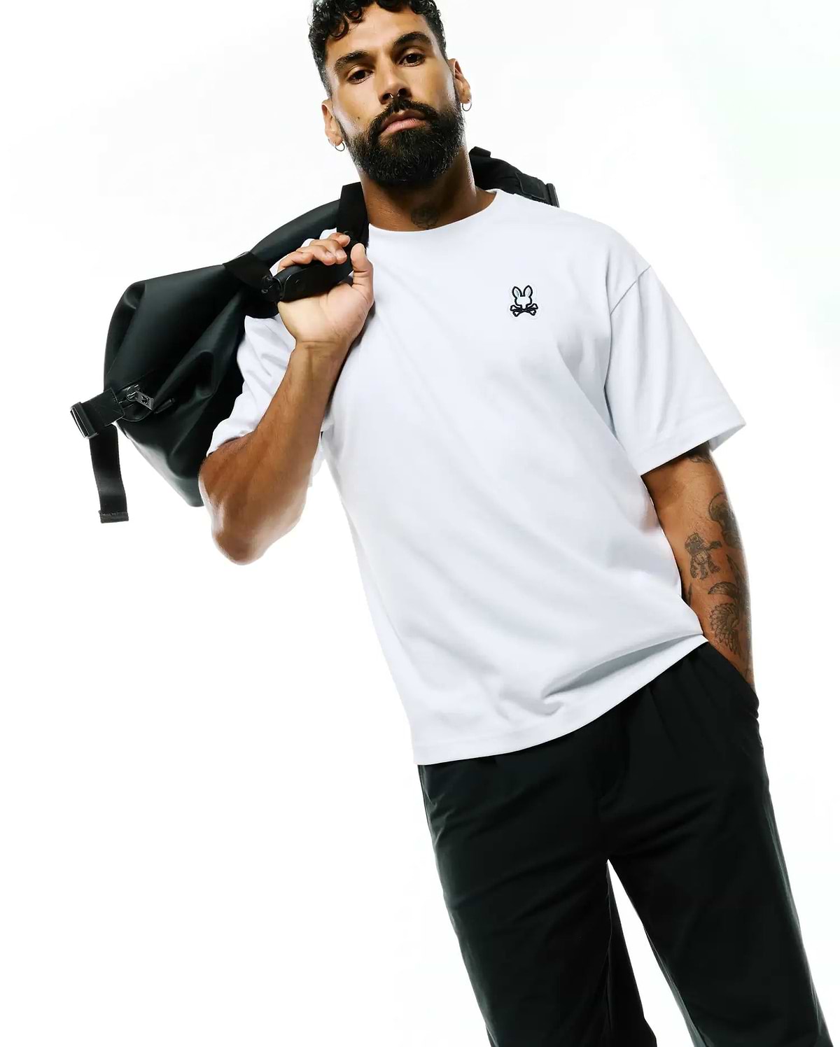 Mens Jaydon Pima Cotton Oversized-Fit Tee in crisp white, featuring a smooth jersey texture and a small, embroidered black Psycho Bunny skull logo on the left chest.