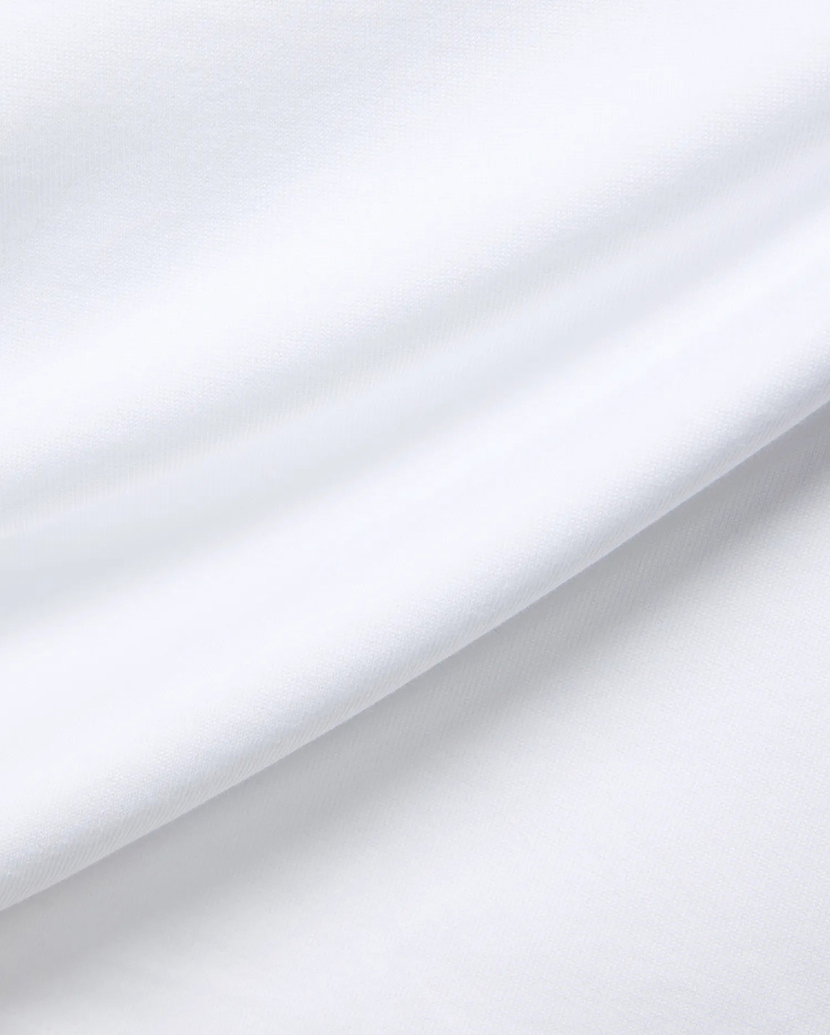 White MENS JAYDON RELAXED FIT TEE, a premium Psycho Bunny garment crafted from soft, breathable jersey fabric, showcasing subtle texture and gentle folds for ultimate comfort.