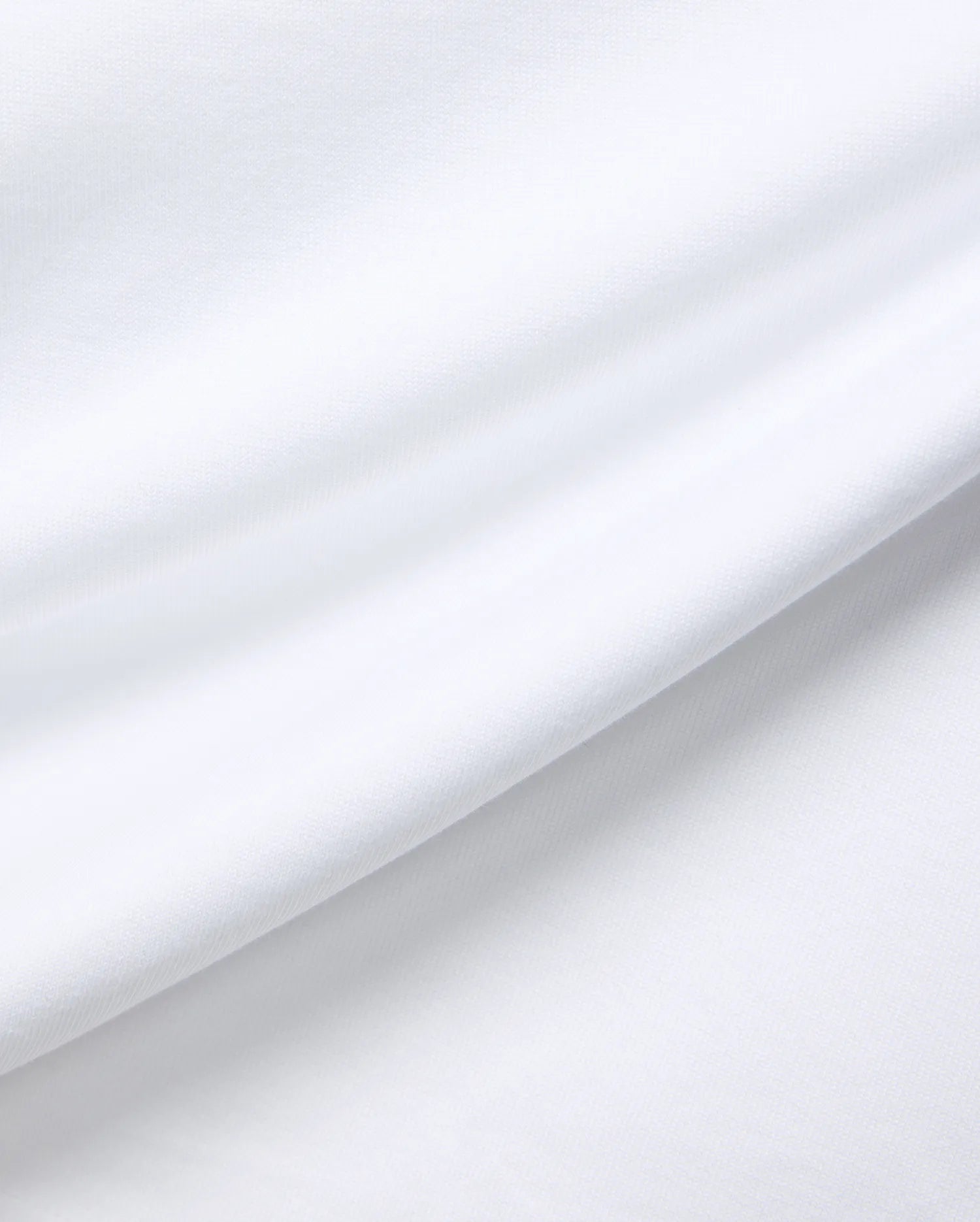 White MENS JAYDON RELAXED FIT TEE, a premium Psycho Bunny garment crafted from soft, breathable jersey fabric, showcasing subtle texture and gentle folds for ultimate comfort.
