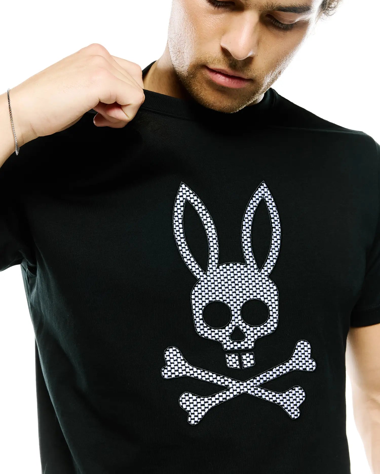 Mens Stan Graphic Tee, black jersey knit t-shirt with a large central checkerboard Psycho Bunny skull and crossbones logo on the chest, featuring a classic fit.
