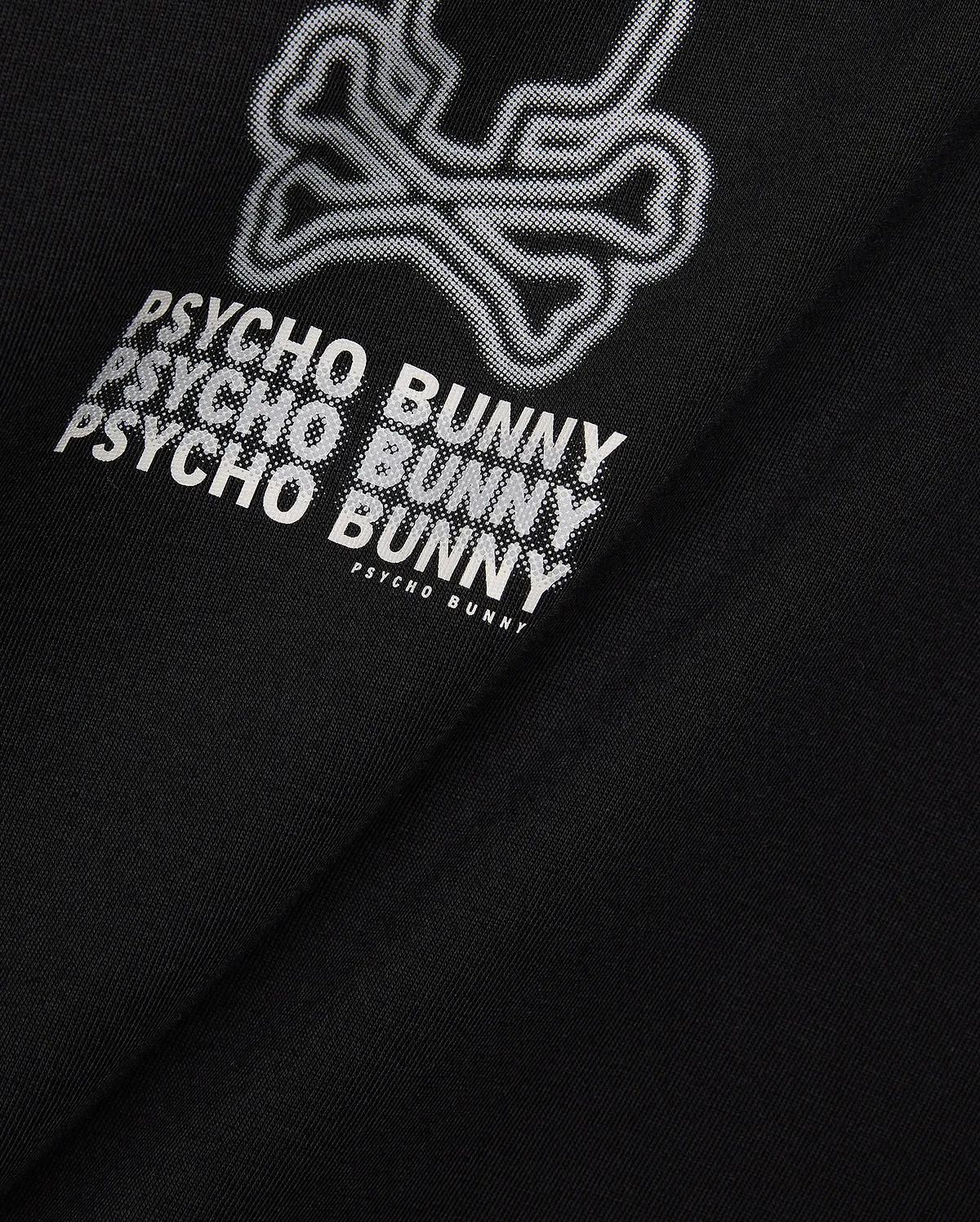 Mens Alex Relaxed Back Graphic Tee in black jersey knit, featuring a large white dotted outline bunny skull and repeated Psycho Bunny text graphic on the back.