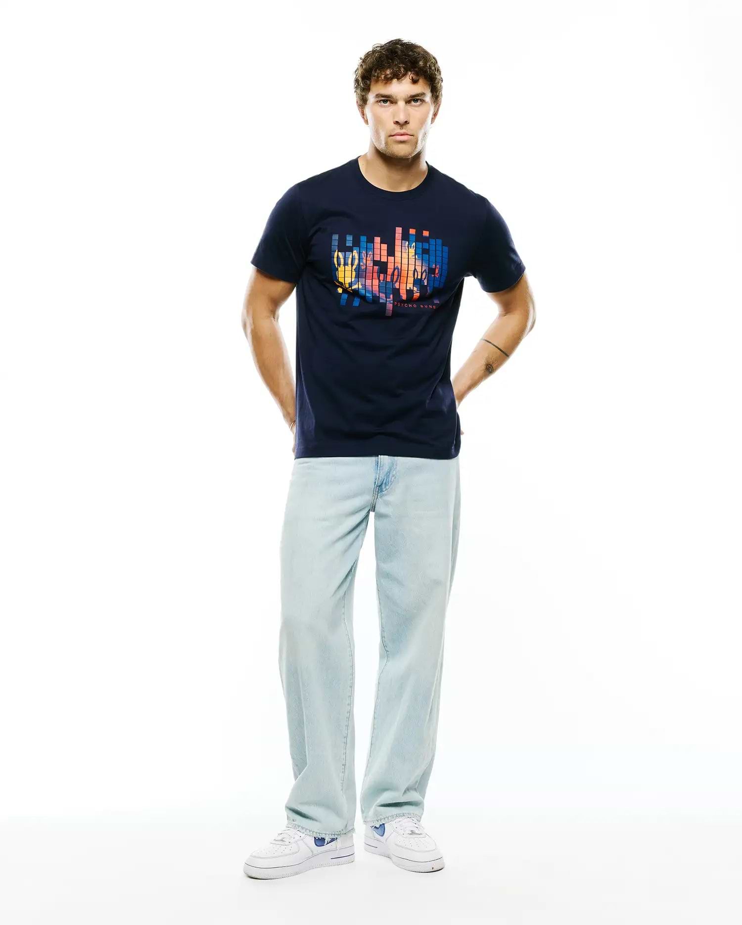 Navy Mens Zander Graphic Tee in classic fit jersey, featuring a large vibrant pixelated chest graphic integrating the iconic Psycho Bunny skull and brand text.