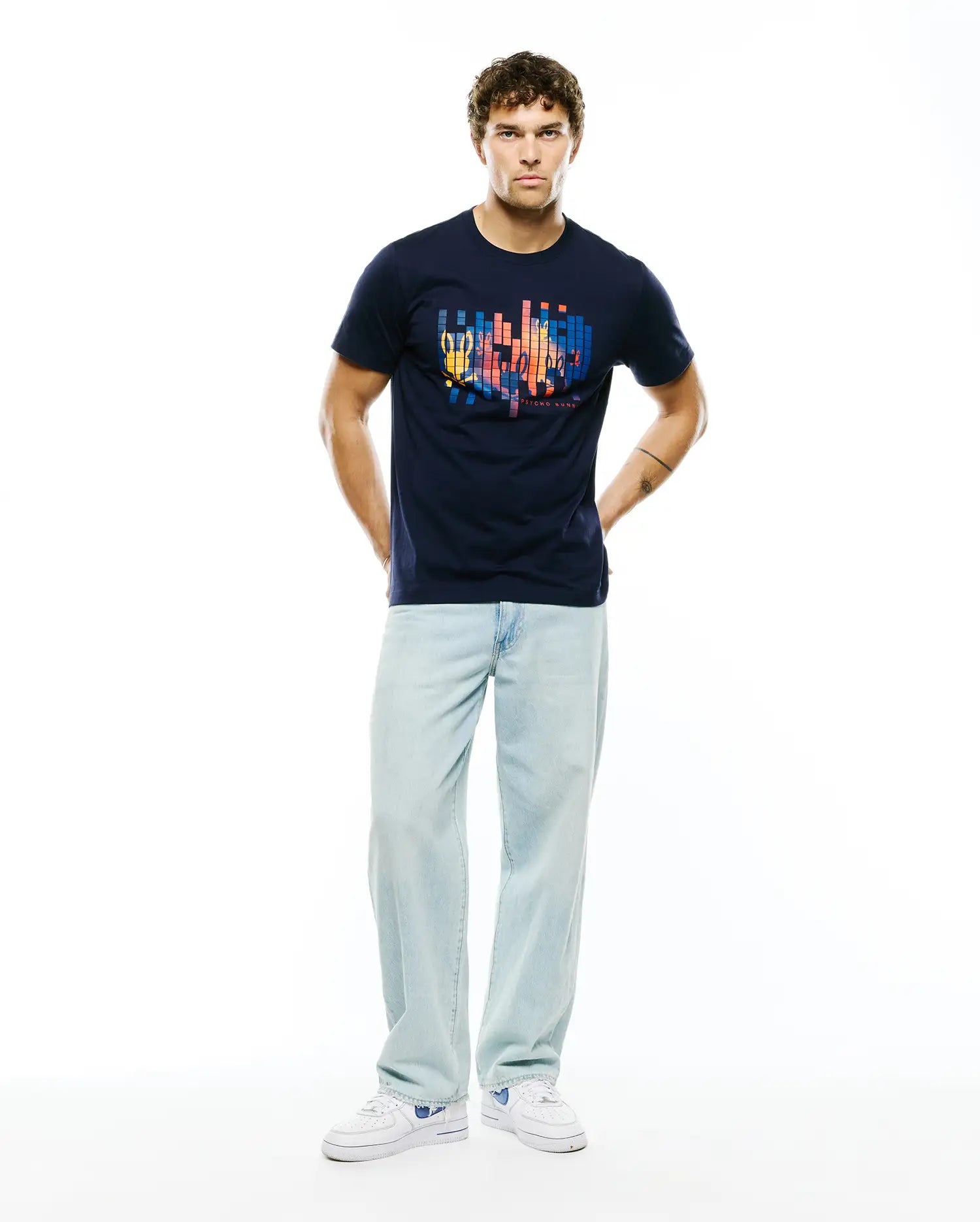 Navy Mens Zander Graphic Tee in classic fit jersey, featuring a large vibrant pixelated chest graphic integrating the iconic Psycho Bunny skull and brand text.