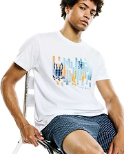 Mens Zander Graphic Tee, a white classic fit jersey t-shirt with a prominent pixelated blue and orange Psycho Bunny skull graphic on the chest, featuring subtle brand text below.