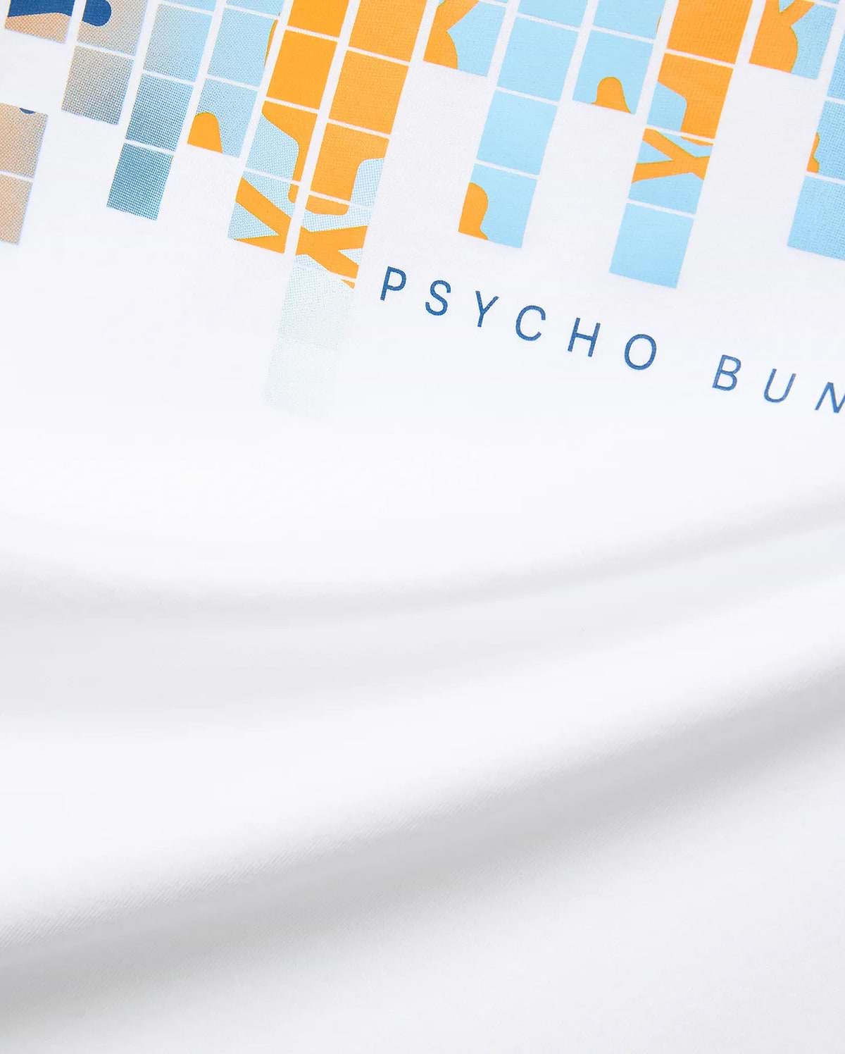 White Mens Zander Graphic Tee with a vibrant pixelated orange, light blue, and beige graphic print, featuring the signature dark blue PSYCHO BUNNY text logo prominently on the front chest, crafted from soft jersey.