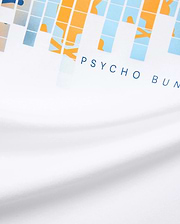 White Mens Zander Graphic Tee with a vibrant pixelated orange, light blue, and beige graphic print, featuring the signature dark blue PSYCHO BUNNY text logo prominently on the front chest, crafted from soft jersey.