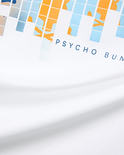 White Mens Zander Graphic Tee with a vibrant pixelated orange, light blue, and beige graphic print, featuring the signature dark blue PSYCHO BUNNY text logo prominently on the front chest, crafted from soft jersey.