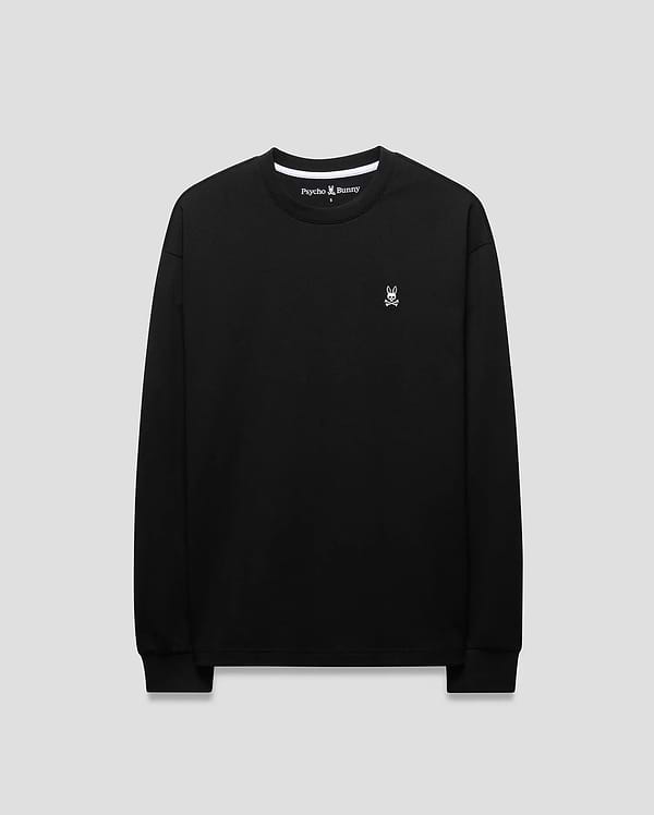 Mens Norman Long Sleeve Oversized Fit Tee in black jersey knit, featuring a small white embroidered Psycho Bunny skull logo on the left chest and white branded inner neck tape.