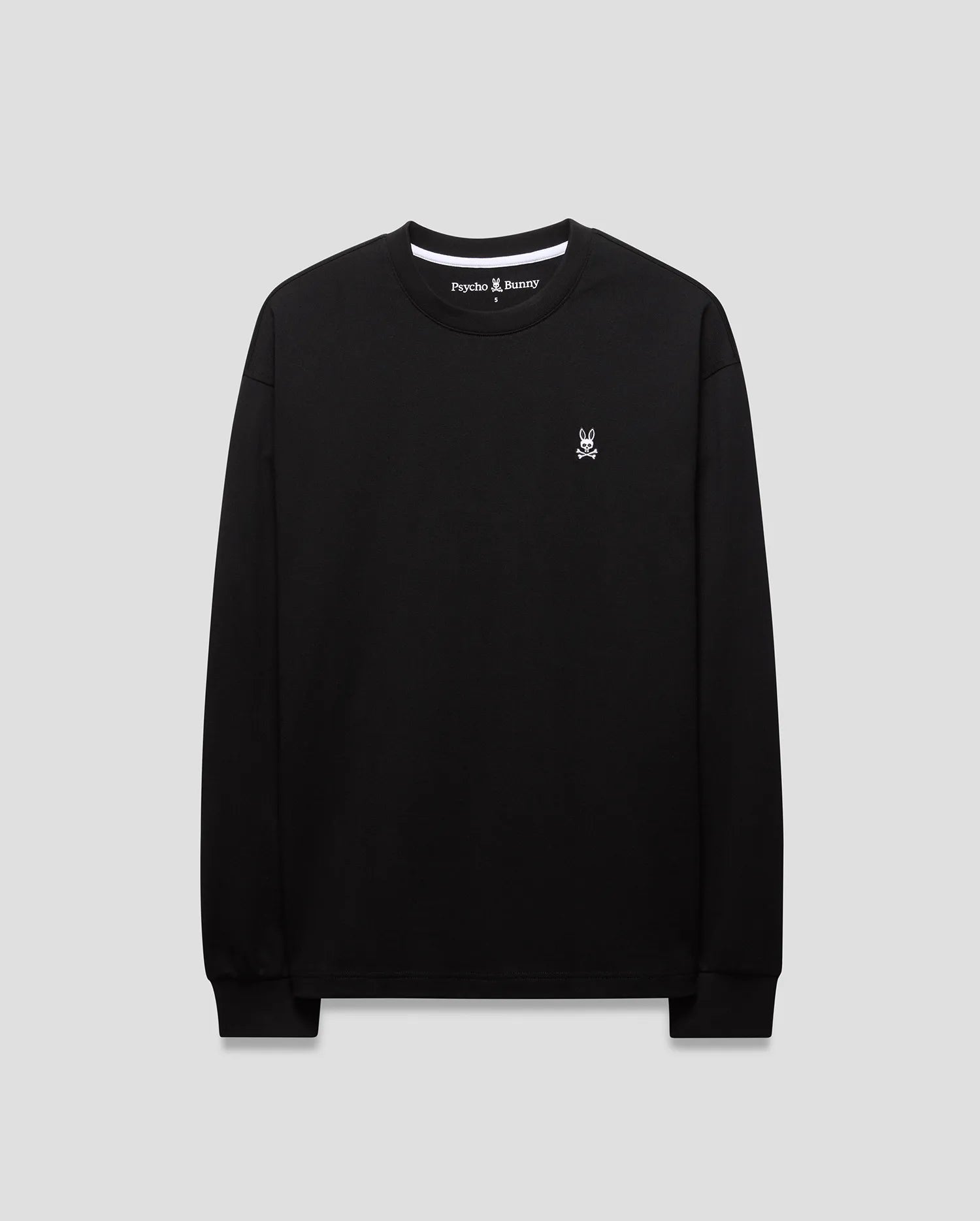 Mens Norman Long Sleeve Oversized Fit Tee in black jersey knit, featuring a small white embroidered Psycho Bunny skull logo on the left chest and white branded inner neck tape.