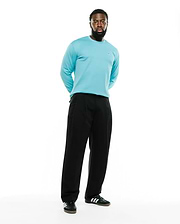 Men's Norman Longsleeve Oversized Tee in aqua blue, featuring a smooth jersey knit fabric and a small embroidered Psycho Bunny skull logo on the left chest. (4)