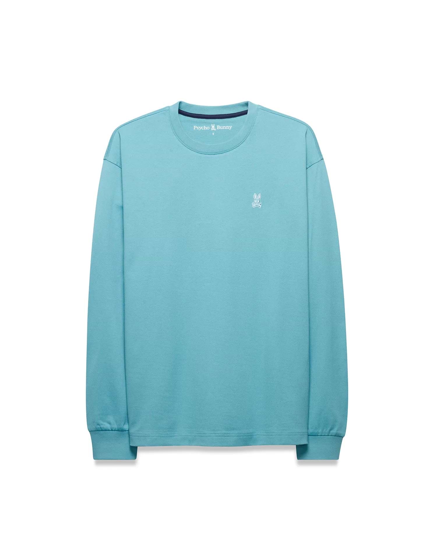 Men's Norman Longsleeve Oversized Tee in aqua blue, featuring a smooth jersey knit, an oversized fit, and a small white embroidered Psycho Bunny skull logo on the left chest with navy neck tape. (5)