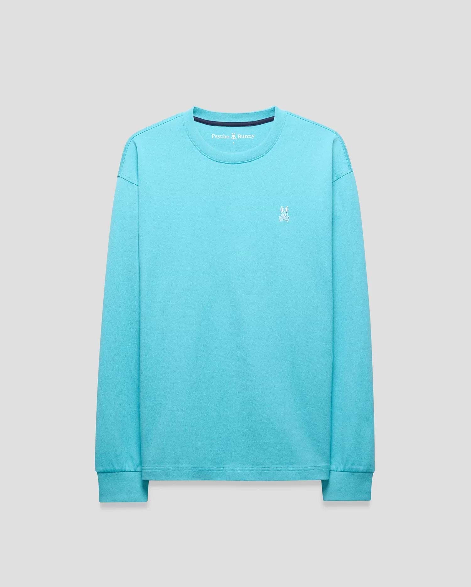 Mens Norman Long Sleeve Relaxed Fit Tee in vibrant aqua jersey knit, featuring a small white embroidered Psycho Bunny skull logo on the left chest, ribbed cuffs, and a navy inner collar.