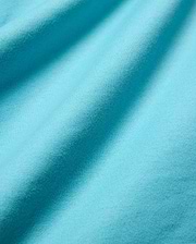Mens Norman Long Sleeve Relaxed Fit Tee in vibrant aqua jersey knit, highlighting its soft, finely textured fabric with subtle vertical ribbing and gentle folds.