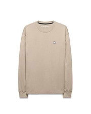 Mens Norman Long Sleeve Relaxed Fit Tee in beige, crafted from soft jersey knit, featuring a small, iconic embroidered Psycho Bunny skull logo on the left chest.