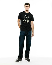Mens Bruno Graphic Tee, a black classic fit jersey knit t-shirt featuring a large, centered neon yellow-green Psycho Bunny skull logo graphic.