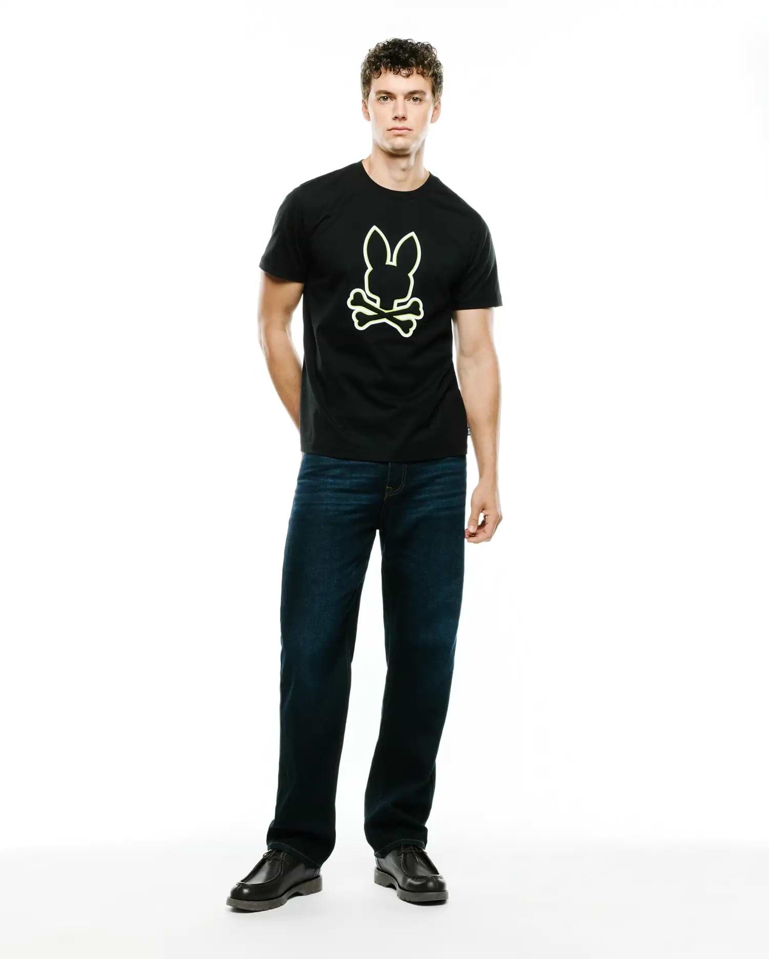 Mens Bruno Graphic Tee, a black classic fit jersey knit t-shirt featuring a large, centered neon yellow-green Psycho Bunny skull logo graphic.