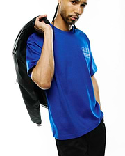 Mens Nathaniel Relaxed Fit Tee, a vibrant royal blue jersey knit with a relaxed fit, showcasing a prominent white Psycho Bunny triple skull logo and brand text on the left chest, embodying refined streetwear.