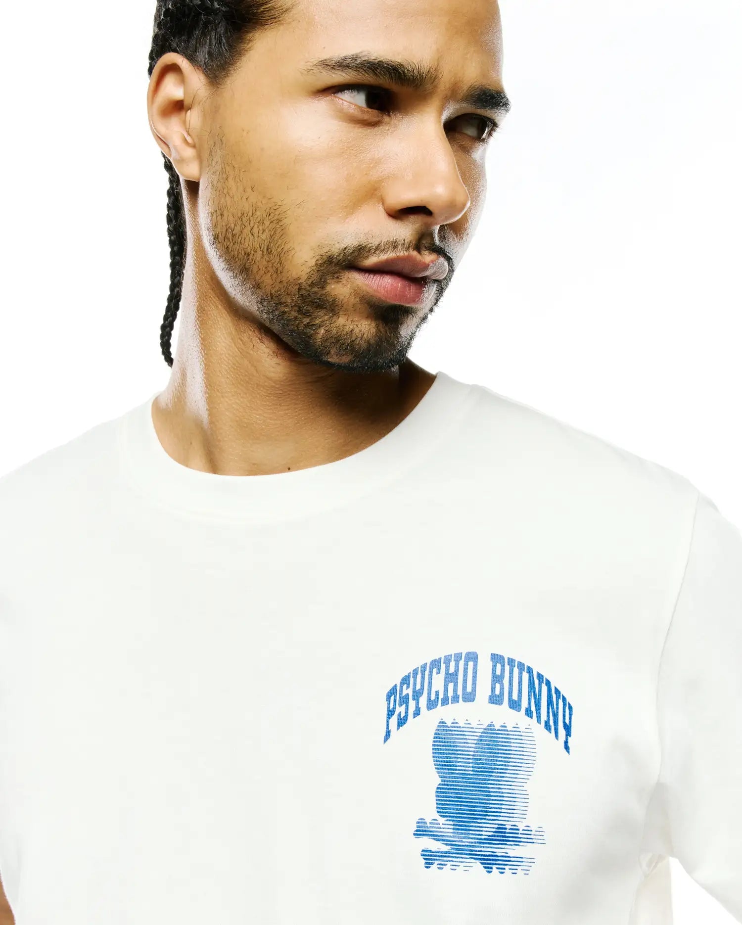 Mens Nathaniel Back Graphic Tee, a classic fit white jersey t-shirt with a large blue Psycho Bunny skull logo graphic featuring horizontal lines and arched PSYCHO BUNNY text on the chest.