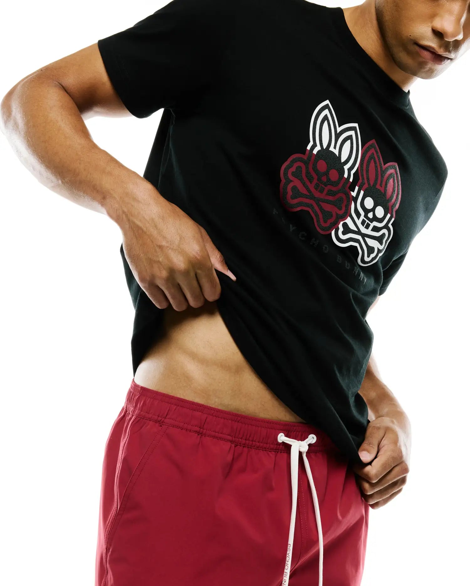 Mens Ledger Graphic Tee, black classic fit jersey with a large red and white overlapping bunny skull graphic and Psycho Bunny text on the center chest.